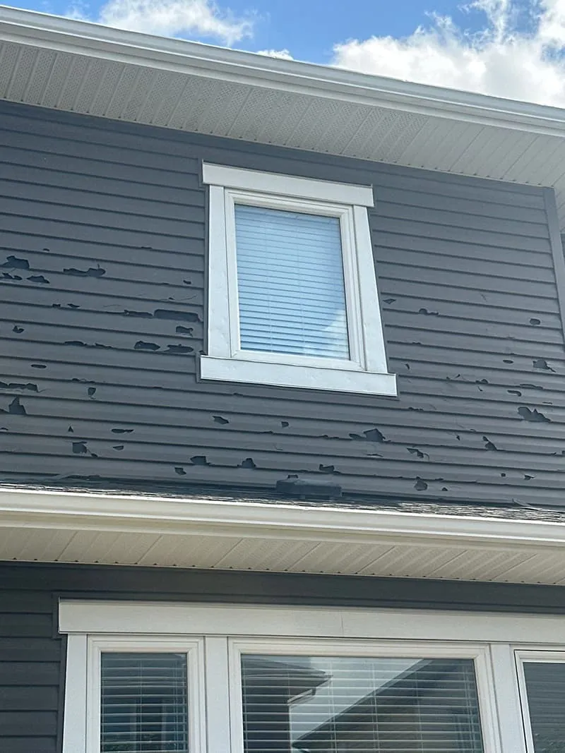 Dedicated Roofing team member working on a rooftop in Calgary.