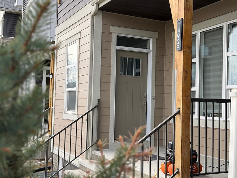 A Calgary home with new siding installed by Dedicated Roofing & Exteriors