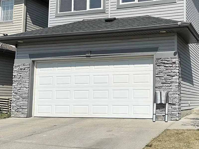 Stone siding installation work on a Calgary home.