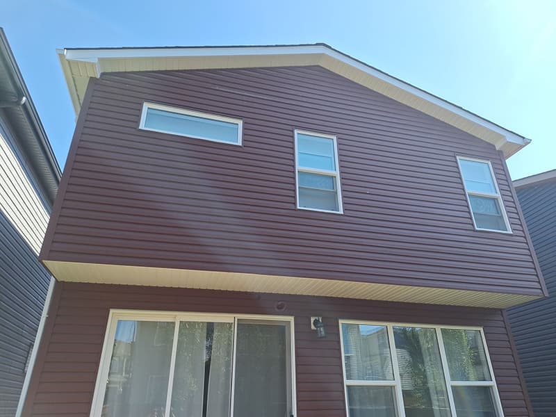 Vinyl siding installation work on a Calgary home.