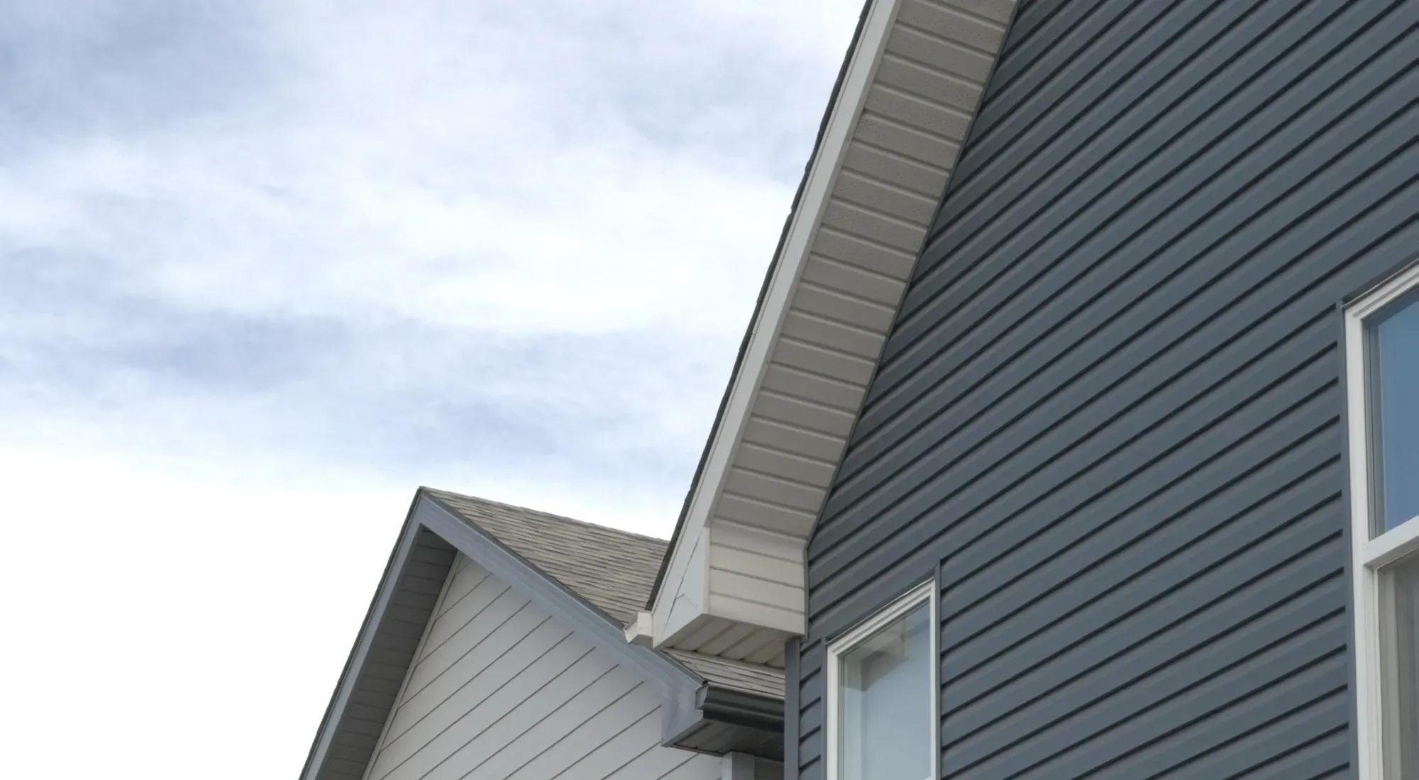 Dedicated Roofing team member working on a rooftop in Calgary.